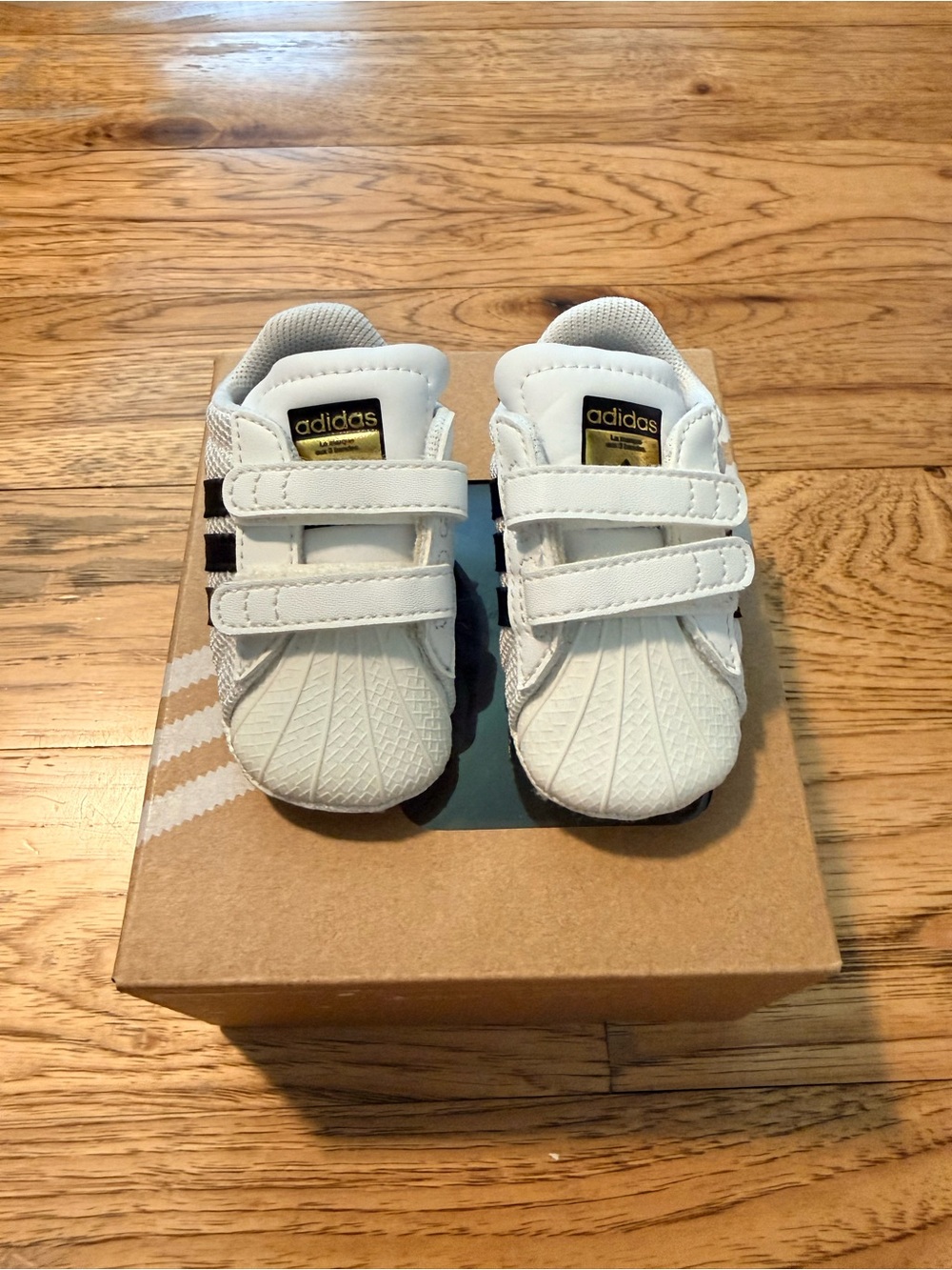 Adidas White Crib Sneakers with Black Stripes & Gold Tongue Badge - Baby/Toddler